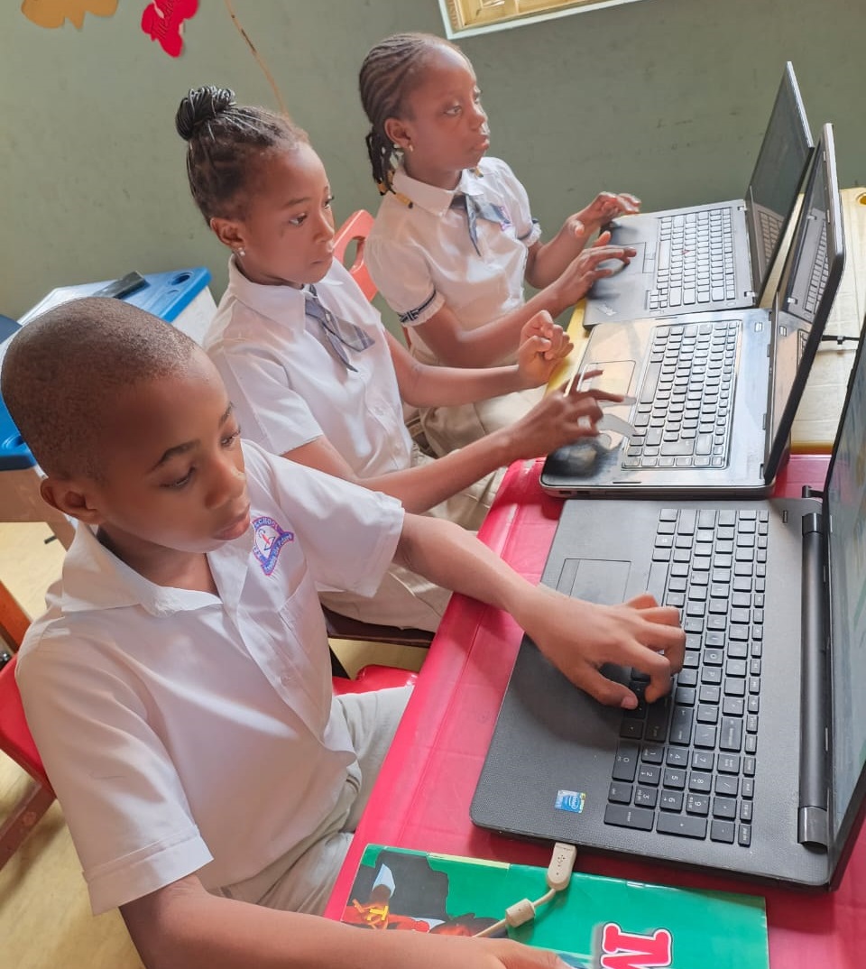 Young pupils smiling together at Kell's School